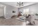 Living room with tiled floors and a comfy couch at 23680 N 168Th Ln, Surprise, AZ 85387