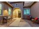 Evening view of a welcoming courtyard with brick pavers and comfortable seating at 23680 N 168Th Ln, Surprise, AZ 85387