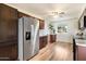 Modern kitchen with stainless steel appliances and wood cabinets at 3826 W Myrtle Ave, Phoenix, AZ 85051