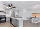 Open kitchen with gray cabinets, an island, and stainless steel appliances at 2650 W Union Hills Dr # 258, Phoenix, AZ 85027