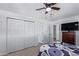 Spacious bedroom with large closet and ceiling fan at 2650 W Union Hills Dr # 258, Phoenix, AZ 85027