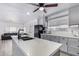 Modern kitchen with gray cabinets and a large island at 2650 W Union Hills Dr # 258, Phoenix, AZ 85027