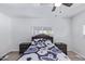 Bright bedroom with a double bed, dresser, and ceiling fan at 2650 W Union Hills Dr # 258, Phoenix, AZ 85027