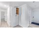 Hallway with white cabinets and wood-look flooring at 2650 W Union Hills Dr # 258, Phoenix, AZ 85027