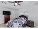 Bright bedroom with a double bed, dresser, and ceiling fan at 2650 W Union Hills Dr # 258, Phoenix, AZ 85027