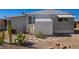 Backyard view with gravel landscaping, storage shed and AC unit at 2650 W Union Hills Dr # 258, Phoenix, AZ 85027