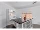 Kitchen island with a butcher block top and white shelving at 2650 W Union Hills Dr # 258, Phoenix, AZ 85027