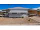 Front view of manufactured home with gravel yard at 2650 W Union Hills Dr # 258, Phoenix, AZ 85027
