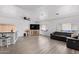 Spacious living room with a large TV and seating at 2650 W Union Hills Dr # 258, Phoenix, AZ 85027