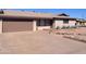 Tan brick house with a two-car garage and landscaped yard at 2338 W Concho Ave, Mesa, AZ 85202