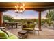 Relaxing patio with seating area and stunning sunset views at 27921 N Agua Verde Dr, Rio Verde, AZ 85263