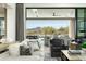 Living room with sliding doors to the pool and mountain views at 7678 E Whisper Rock Trl, Scottsdale, AZ 85266