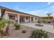 Backyard with covered patio, fire pit, and desert landscaping at 22652 E Munoz St, Queen Creek, AZ 85142