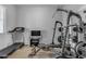 Home gym with treadmill, weight machine, and TV at 22652 E Munoz St, Queen Creek, AZ 85142