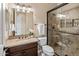 Bathroom with granite vanity and walk-in shower at 28847 N Royce Rd, San Tan Valley, AZ 85144