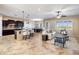 Open floor plan showcasing kitchen island and living room furniture at 28847 N Royce Rd, San Tan Valley, AZ 85144
