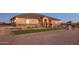 Nice curb appeal, this home features a three car garage and attractive landscaping at 28847 N Royce Rd, San Tan Valley, AZ 85144