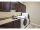 Laundry room with cabinets, sink, and washer/dryer at 28847 N Royce Rd, San Tan Valley, AZ 85144