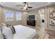 Spacious main bedroom with large TV and ensuite bathroom access at 28847 N Royce Rd, San Tan Valley, AZ 85144