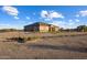 Front view of a single-story house with a three-car garage at 28847 N Royce Rd, San Tan Valley, AZ 85144