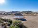 Aerial view of a horse shelter, house, and distant mountains at 28847 N Royce Rd, San Tan Valley, AZ 85144