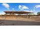 Metal horse shelter with multiple stalls and a covered roof at 28847 N Royce Rd, San Tan Valley, AZ 85144