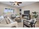 Relaxing living room featuring comfortable seating and large windows at 28847 N Royce Rd, San Tan Valley, AZ 85144