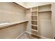 Spacious walk-in closet with ample shelving and hanging rods at 28847 N Royce Rd, San Tan Valley, AZ 85144