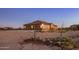 View of the home's side elevation, showcasing the garage and landscaping at 28847 N Royce Rd, San Tan Valley, AZ 85144
