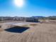 Aerial view of a horse shelter near a house and mountains at 28847 N Royce Rd, San Tan Valley, AZ 85144