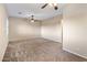 Bright bedroom with ceiling fan and plush carpeting at 28847 N Royce Rd, San Tan Valley, AZ 85144