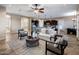 Open living room with neutral decor and access to kitchen at 28847 N Royce Rd, San Tan Valley, AZ 85144
