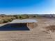 Aerial view of a metal horse shelter in a desert setting at 28847 N Royce Rd, San Tan Valley, AZ 85144