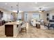 Open concept kitchen and living area with tile floors and neutral tones at 28847 N Royce Rd, San Tan Valley, AZ 85144