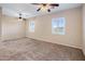 Spacious bedroom with two ceiling fans and carpet at 28847 N Royce Rd, San Tan Valley, AZ 85144