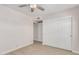 Bedroom with double door closet and tile floors at 813 W Diamond Dr, Tempe, AZ 85283