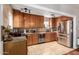 Kitchen with stainless steel appliances and wood cabinets at 1840 E Culver St, Phoenix, AZ 85006