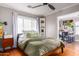 Main bedroom with a green comforter and built-in shelving at 1840 E Culver St, Phoenix, AZ 85006