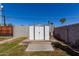 White shed in the backyard with a concrete slab at 1840 E Culver St, Phoenix, AZ 85006