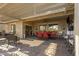 Spacious covered patio with seating area, perfect for outdoor entertaining at 42597 W Kingfisher Dr, Maricopa, AZ 85138