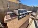 Built-in outdoor kitchen with grill at 8791 W Kathleen Rd, Peoria, AZ 85382