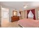 Bedroom with a double bed, wooden dresser, and mirrored closet doors at 3270 S Goldfield Rd # 315, Apache Junction, AZ 85119