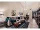 Open living room and dining area with L-shaped sofa and tile floors at 1116 E Belmont Ave, Phoenix, AZ 85020
