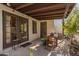 Private patio with seating and access to home at 1116 E Belmont Ave, Phoenix, AZ 85020
