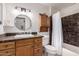 Updated bathroom with dark vanity and tile at 1116 E Belmont Ave, Phoenix, AZ 85020