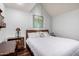 Bright bedroom with king-size bed, wood furniture, and artwork at 1116 E Belmont Ave, Phoenix, AZ 85020