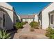 Shared courtyard with walkways and landscaping between homes at 1116 E Belmont Ave, Phoenix, AZ 85020