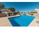 Community pool with surrounding patio area at 1116 E Belmont Ave, Phoenix, AZ 85020