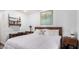 King-size bed, wood furniture, and artwork in a well-lit bedroom at 1116 E Belmont Ave, Phoenix, AZ 85020
