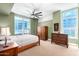 Bright bedroom with a wood bed frame and large window at 120 E Rio Salado Pkwy # 201, Tempe, AZ 85281